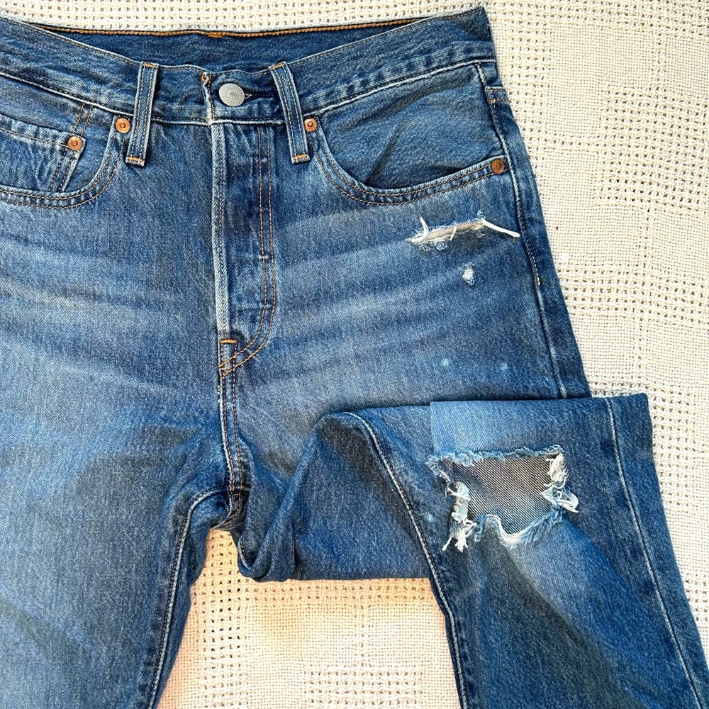 Levi’s 501 dark wash straight leg with ripped knee